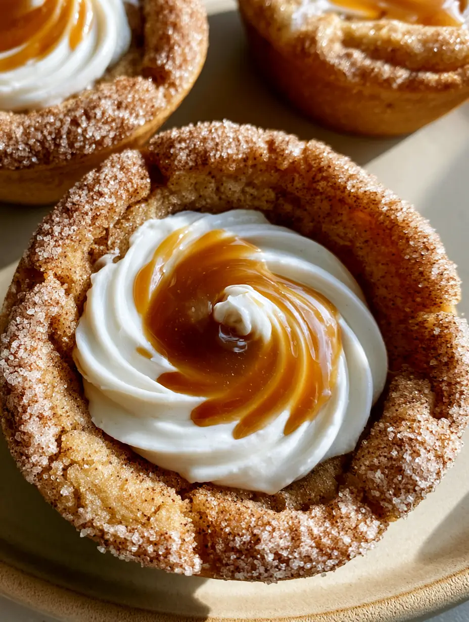 Overhead shot of sparkling snickerdoodle cookie cups with crinkled edges and cream cheese swirls. (snickerdoodle cookie cups)